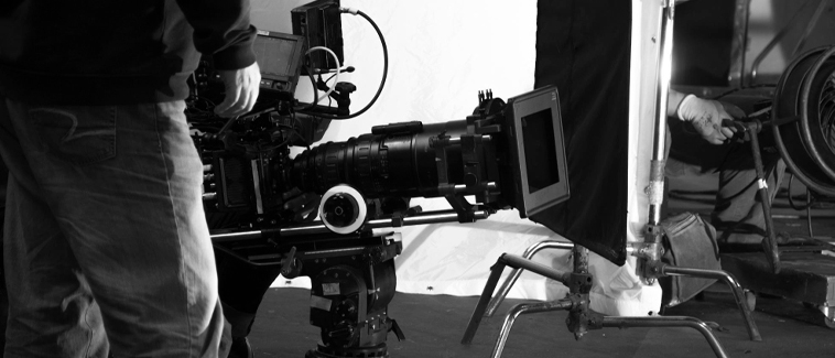 Cinematographer working with professional film camera on set for The Short Film Festival 2026 advisory board announcement and ongoing short film submissions
